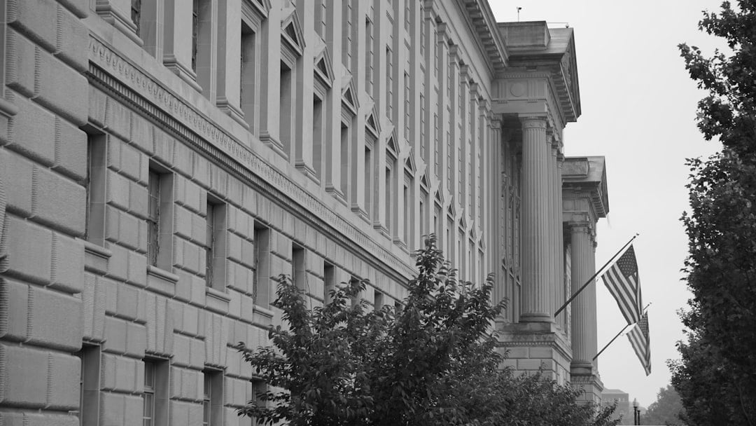 white concrete building during daytime — context for gold price Iran war (energy bills angle)