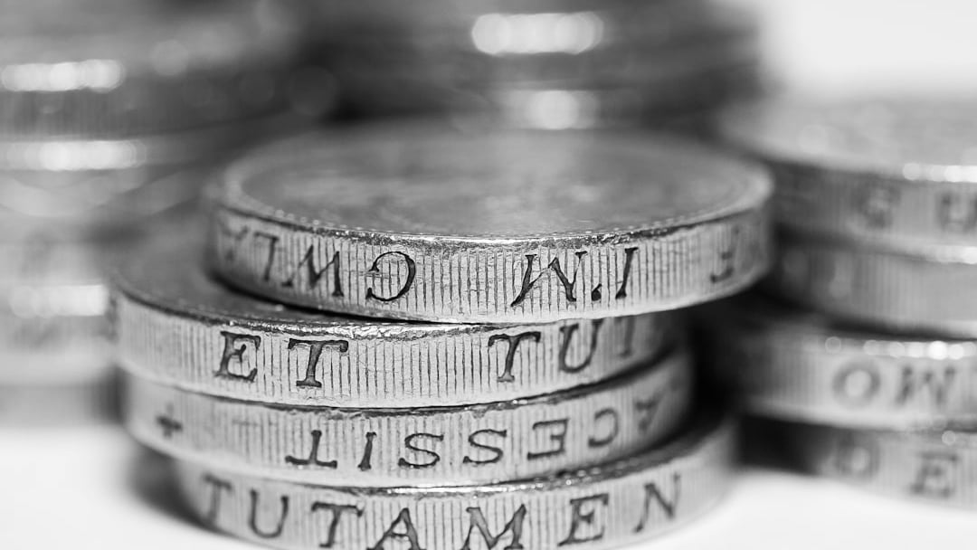 a pile of gold coins sitting on top of each other — illustrating IFS wealth tax warning