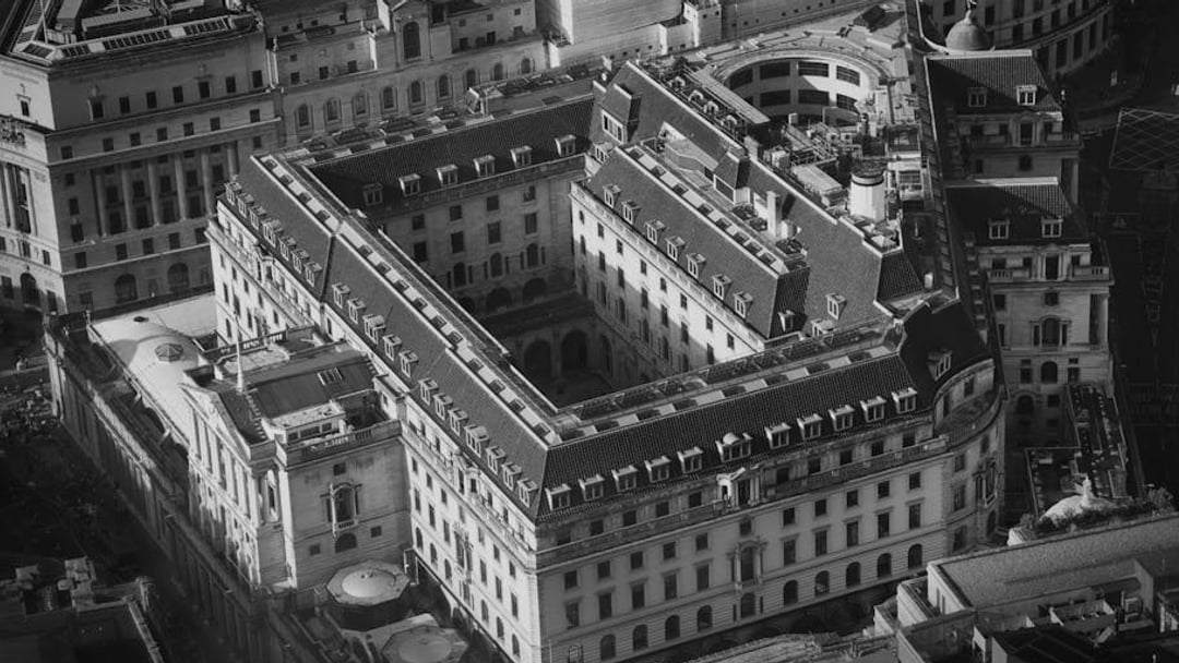 A detailed aerial shot of the historical Bank of England in London, showcasing its grand architecture — context for UK