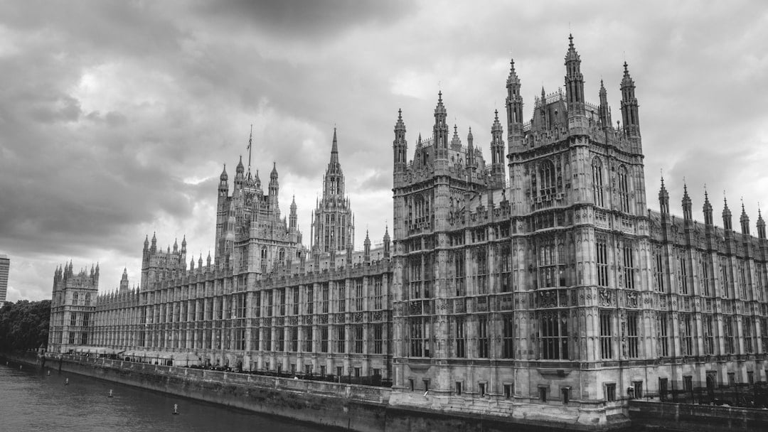 Palace of Westminster towers — anchoring the politics-of-reform beat before the conclusion — symbolising GDP