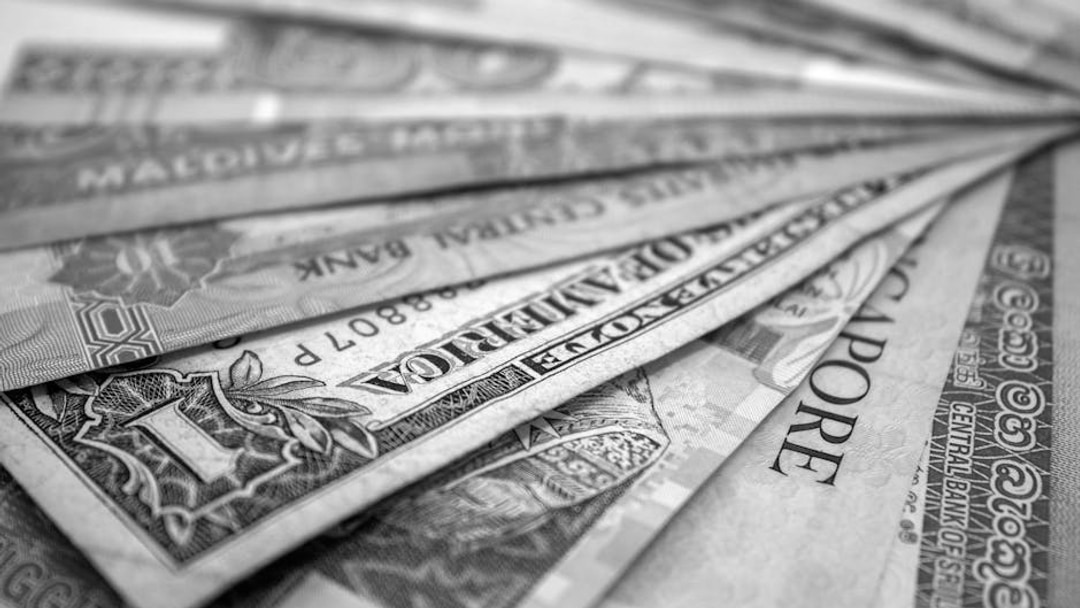 A close-up view of various international banknotes showcasing diverse currencies, illustrating BlackRock tokenization