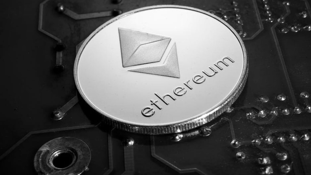 Close-up of an Ethereum coin placed on a circuit board, symbolizing digital currency technology, illustrating BlackRock