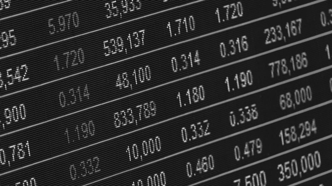 Close-up of a digital stock market data display showing colorful financial numbers and trends, illustrating Intertek share