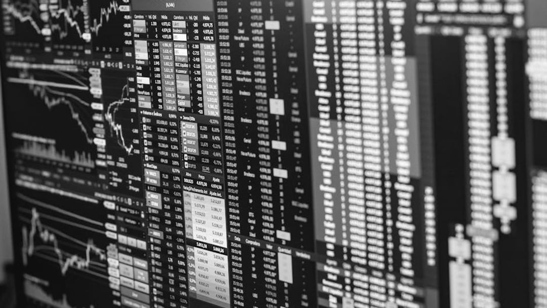 Detailed financial trading screen with colorful charts and data representing market fluctuations, illustrating National Grid