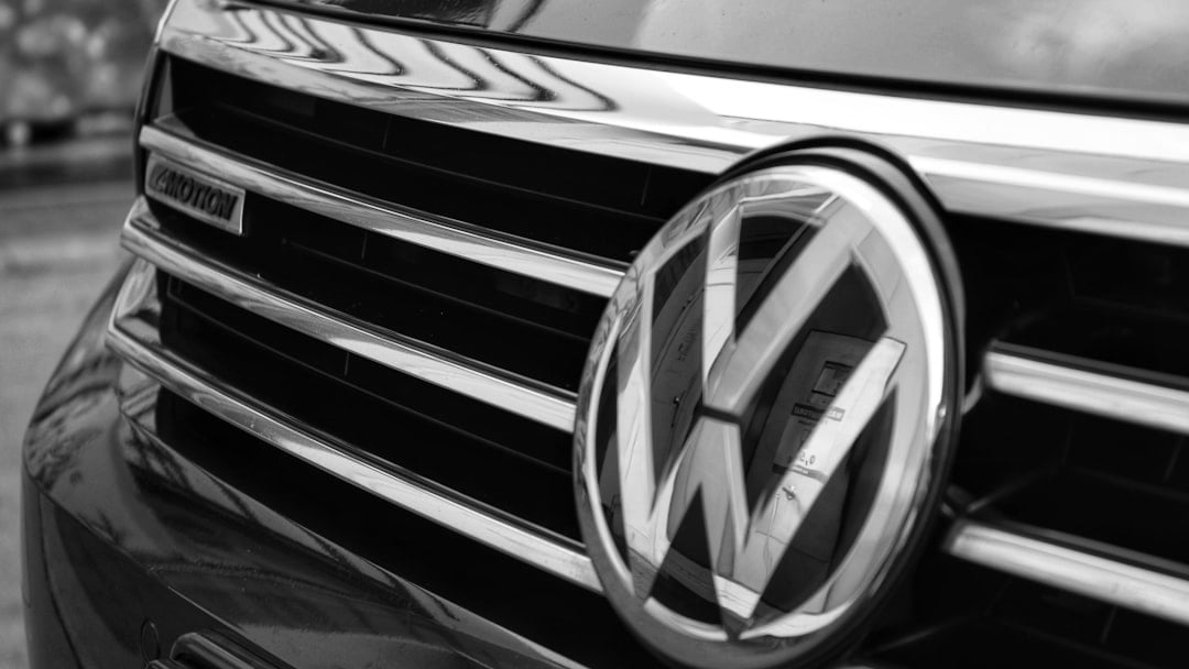 Close-up of a volkswagen car grille with blue accents, illustrating Volkswagen share price