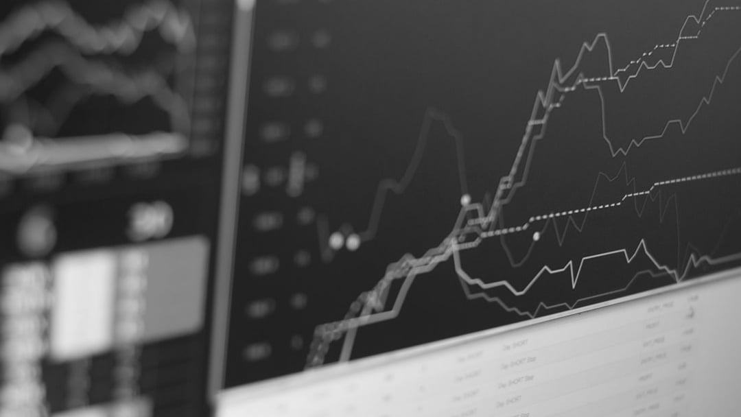 close-up photo of monitor displaying graph, illustrating World Cup sponsors stocks